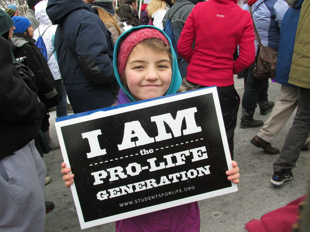 A young girl holds up a pro-life sign at the March for Life in Washinton