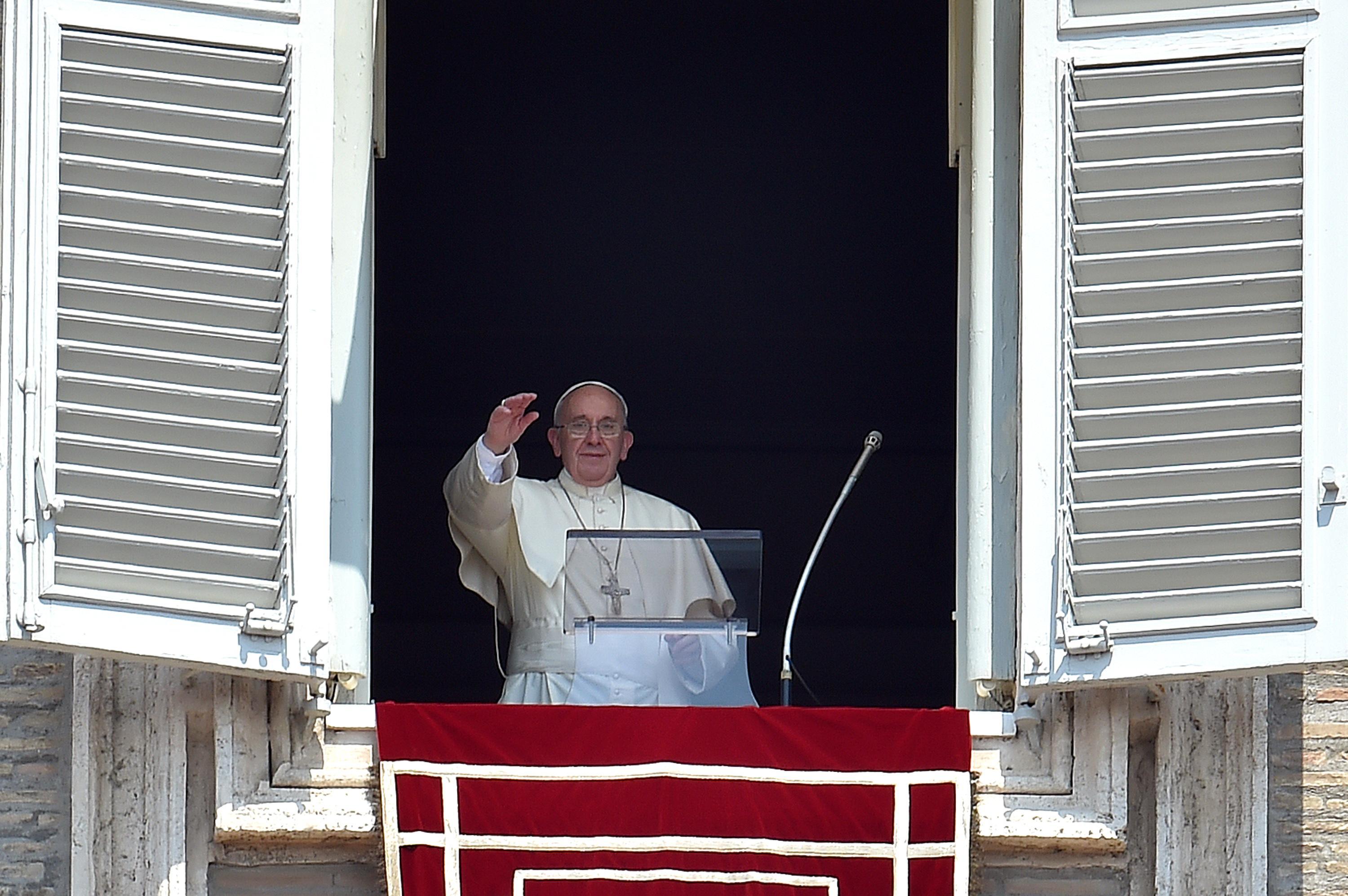 Pope Francis greets the faithful at the Angelus