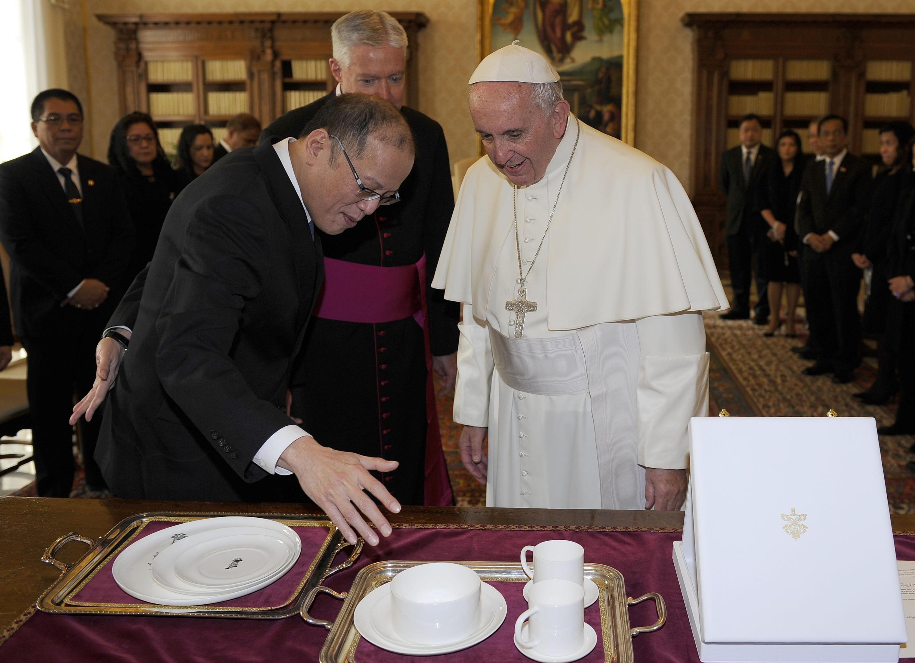 Pope Francis speaks with President Benigno S. Aquino III of the Philippines  during a private audience at the Vatican City