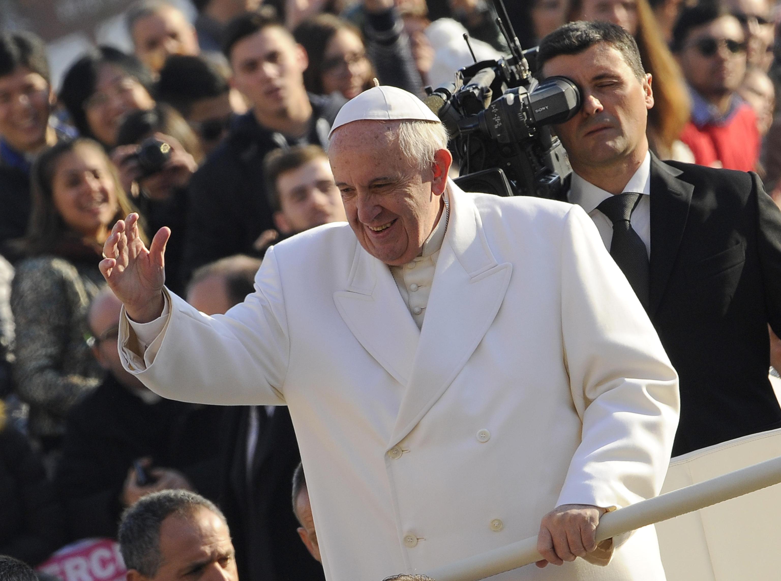 Pope Francis greets the faithful at his weekly general audience