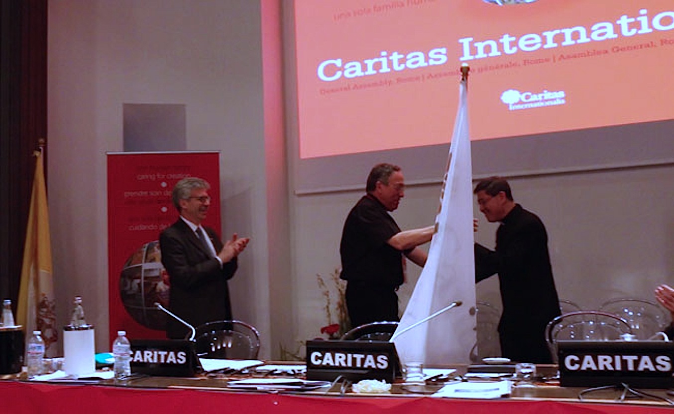 Cardinal Maradiaga handed the flag of Caritas Internationalis to Cardinal Luis Antonio Tagle