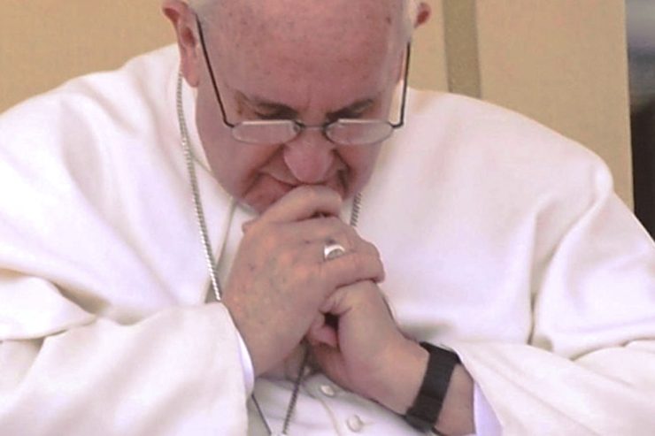 Francis in prayer. Close-up