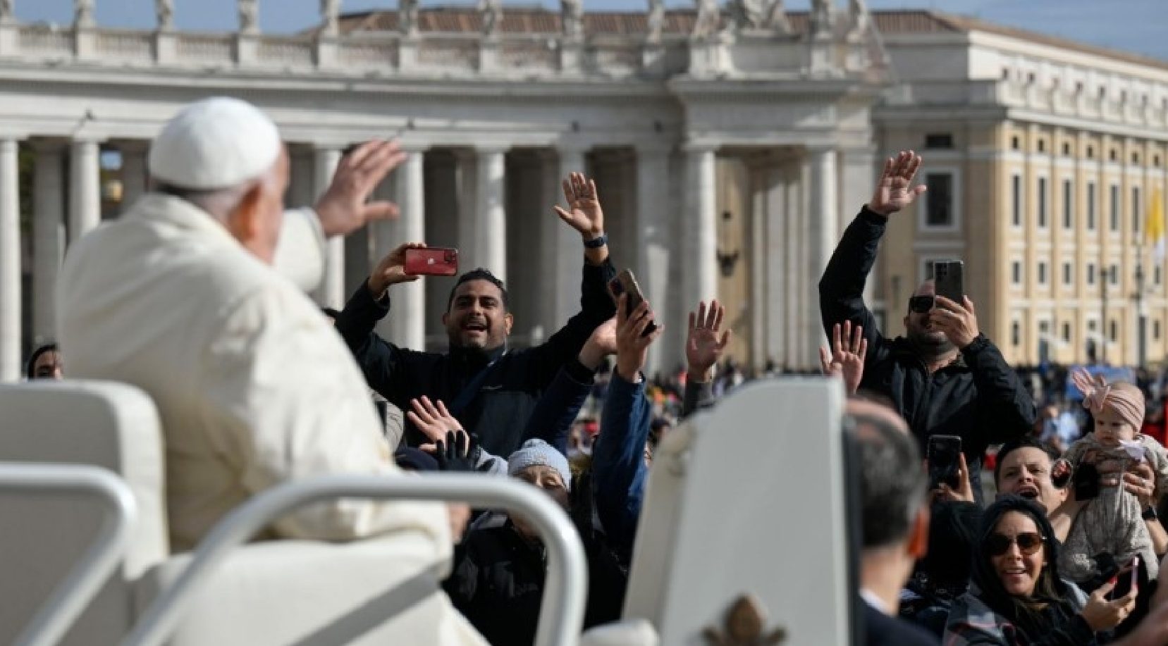 The Pope appeared in a white coat, reflecting the change in weather in Rome